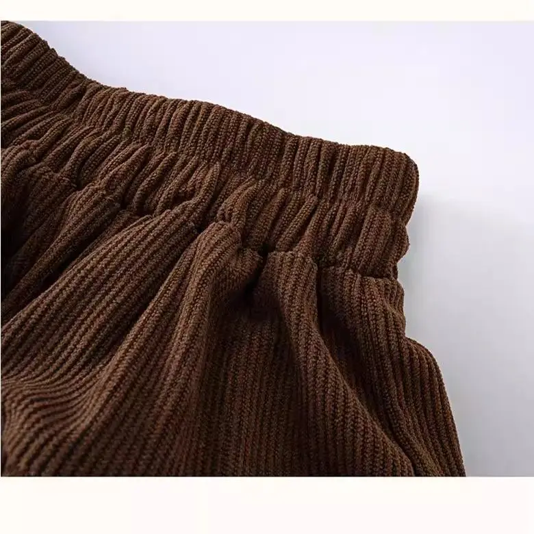 تنورة قصيرة جديدة لخريف وشتاء 2025 للفتيات تنورة كعكة عصرية للأطفال تنورة مطوية مع سراويل أمان