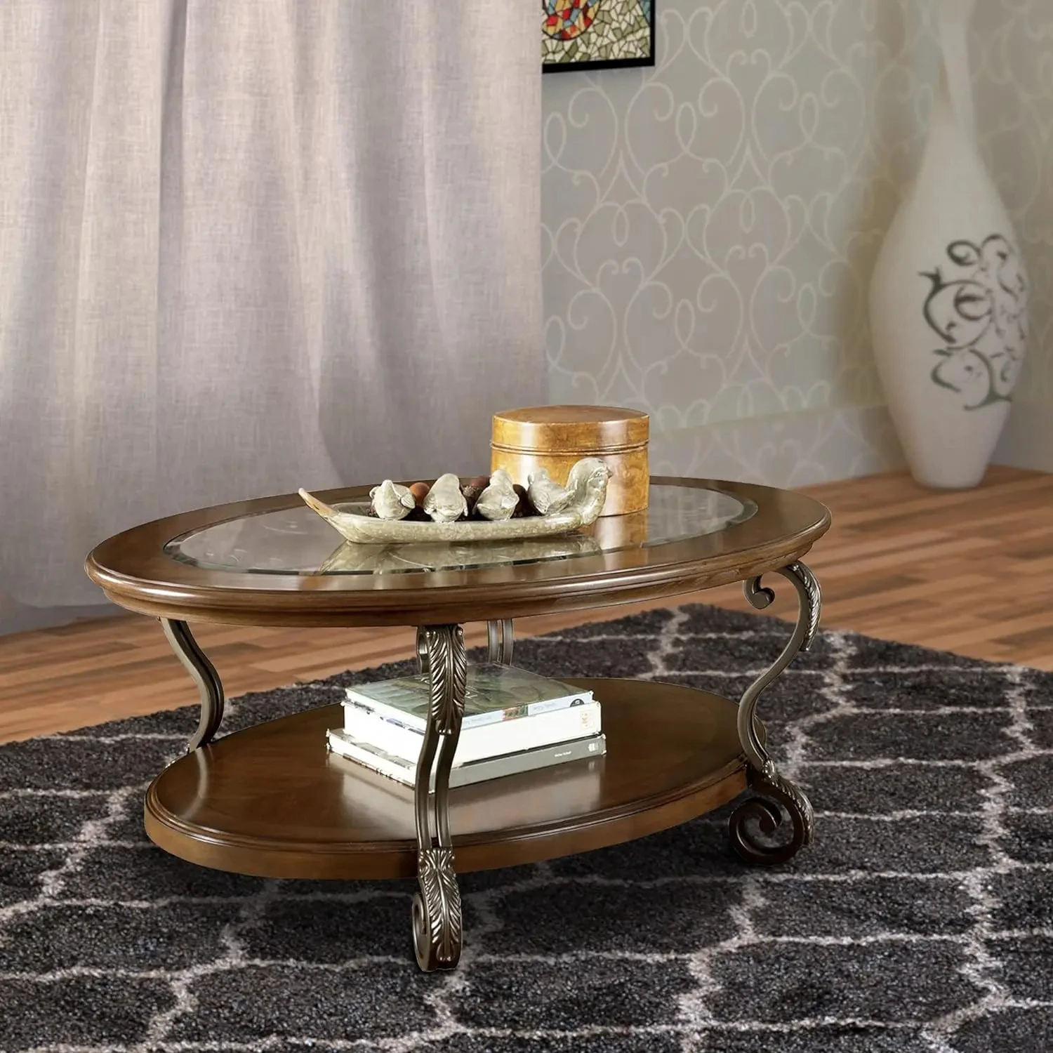 Rectangular Transitional Wooden Oval Cocktail Table with Glass Top and Open Bottom Shelf,Metal Legs with Carvings,Brown