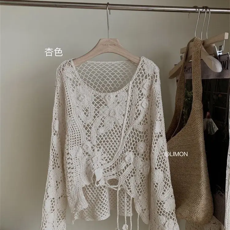 2026 neue Große Lose Sonnencreme Mm Design Hohl Haken Blume Langarm Gestrickte Hemd Abdeckung Top Frauen Äußere