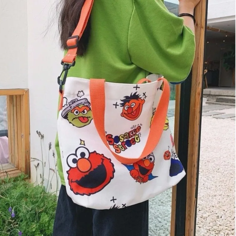 Sesame Street animation peripheral cartoon cute student large capacity canvas tote bag creative personalized crossbody handbag