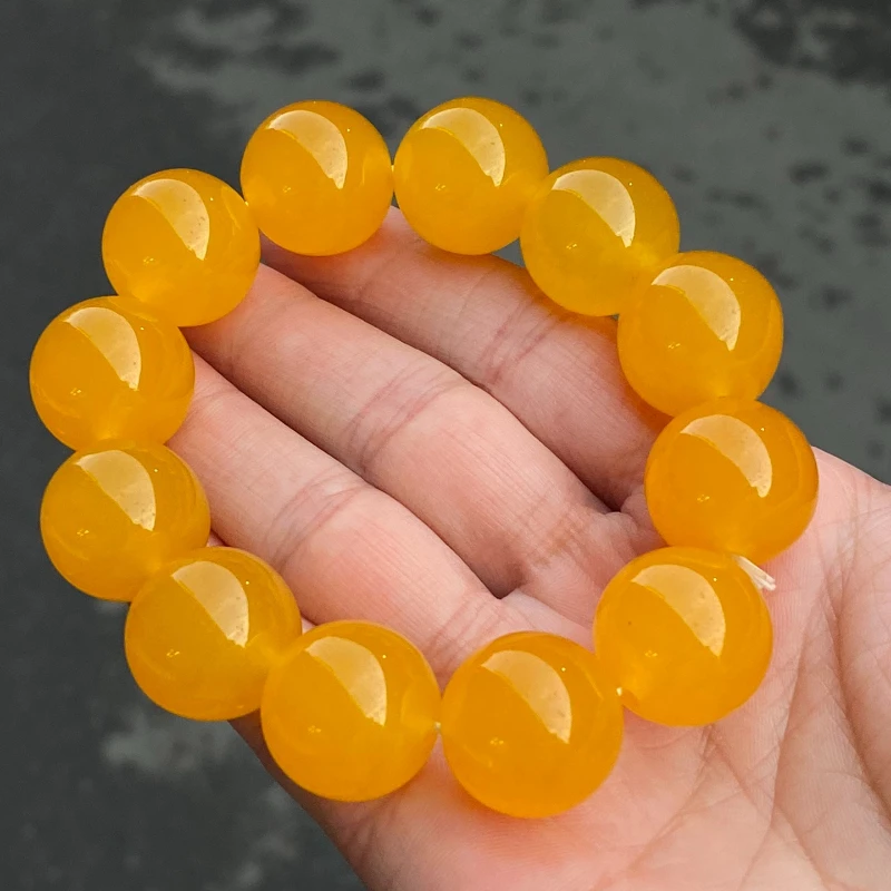 

Новый браслет с одним кольцом из натурального ледяного кварцита и нефрита оранжево-желтого цвета.