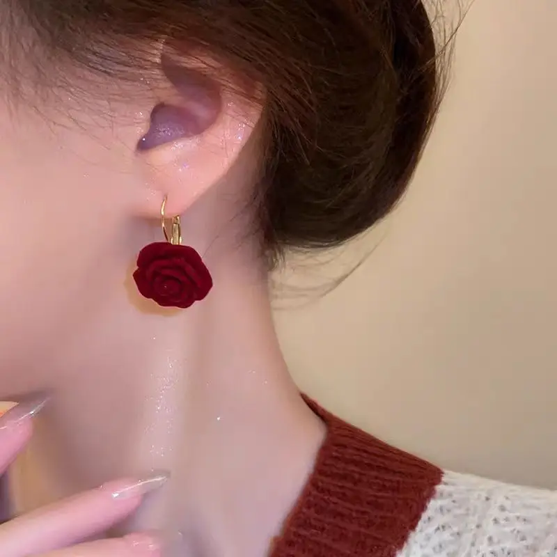 An elegant pair of women's earrings, these vintage Hong Kong style burgundy rose earrings are fashionable, trendy, and sophisticated. They flatter the skin tone, enhance one's overall look, and are versatile enough to match any outfit.