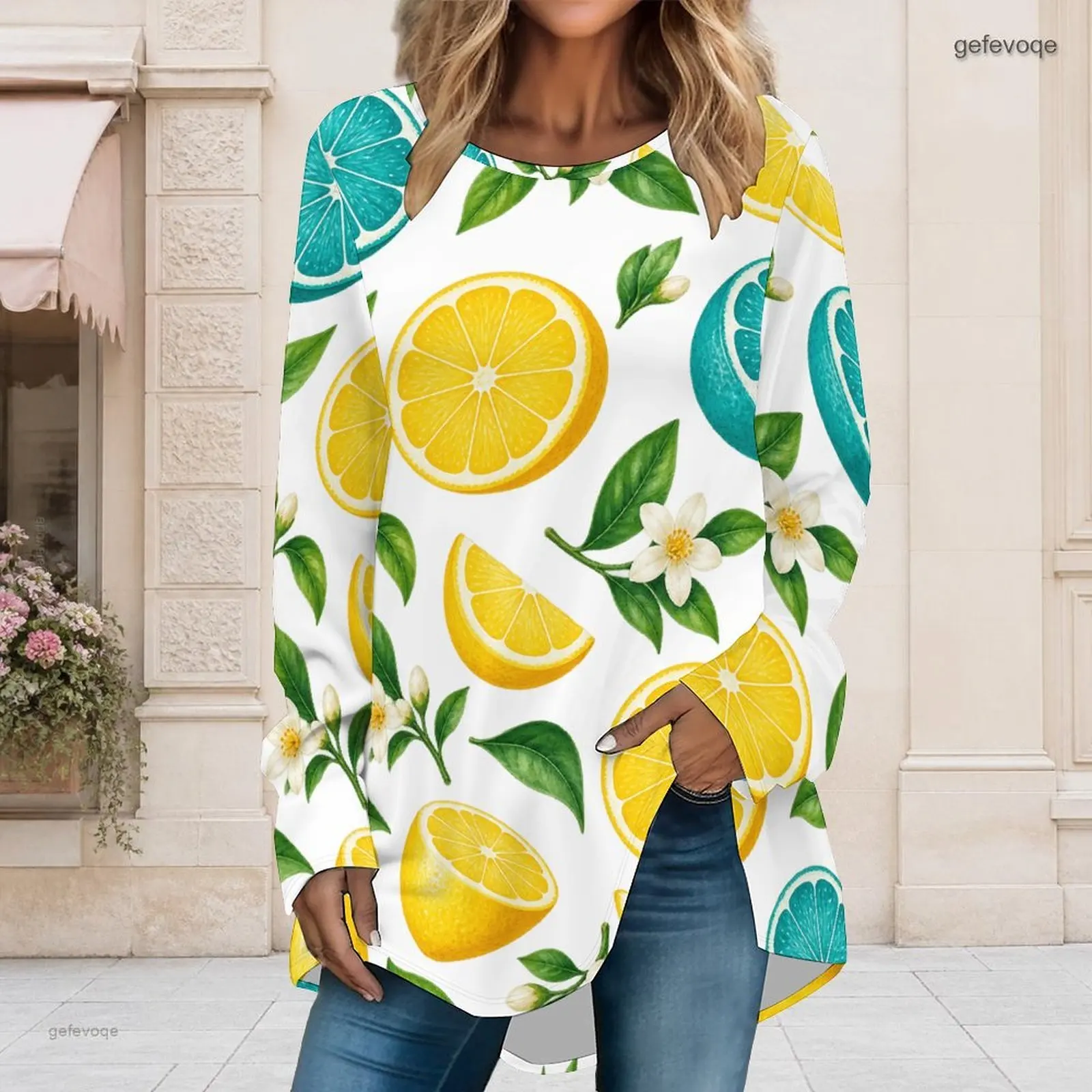 Blusa de manga larga con cuello redondo y estampado para mujer, color amarillo limón, verde lima y diseño floral de cítricos, corte holgado, bajo asimétrico, estilo casual.