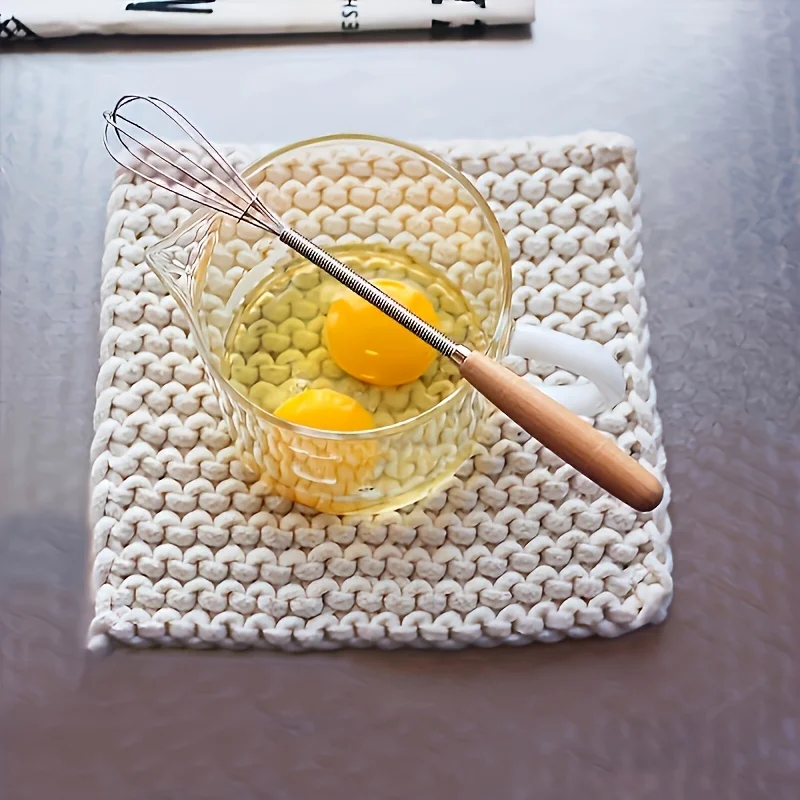 A stainless steel mini egg beater with a wooden handle - multifunctional manual egg beater, milk frother and coffee mixer