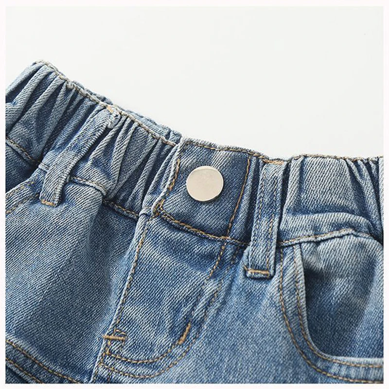 ملابس الصيف للفتيات على الطراز الكوري لعام 2025 تنورة دينم مكشكشة للفتيات اليومية في الهواء الطلق تنورة جينز قصيرة غير رسمية ملابس الأطفال