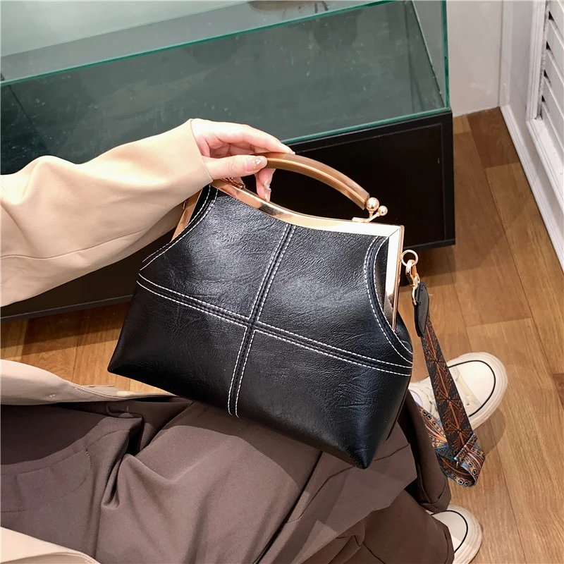 Advanced retro shell bag for women's 2024 new fashionable handbag clip bag with wide shoulder straps and diagonal cross bag