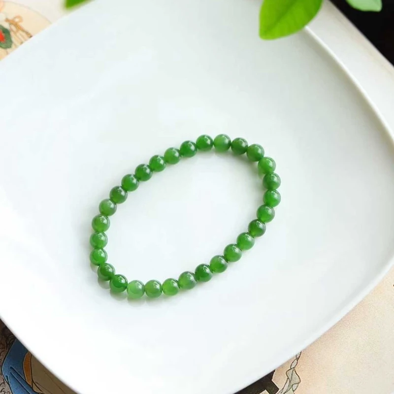 

Натуральный хэтяньский нефрит, русский нефрит, старый материал, круглые бусины цвета шпинатного зеленого, гладкий браслет из жадеита.