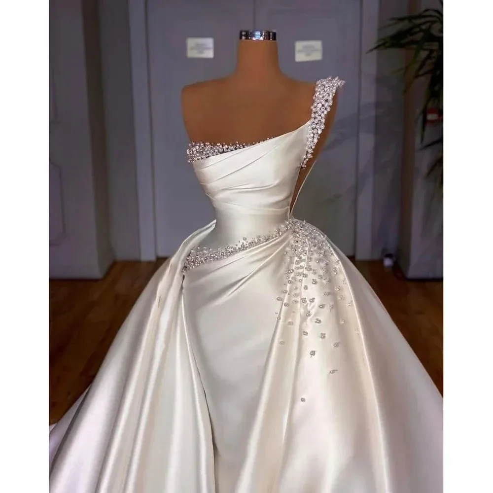 

Свадебные платья Flavinke из атласа с жемчугом на заказ, роскошные, фасона «русалка», на одно плечо, с бисером и отстегивающейся юбкой, африканские свадебные платья