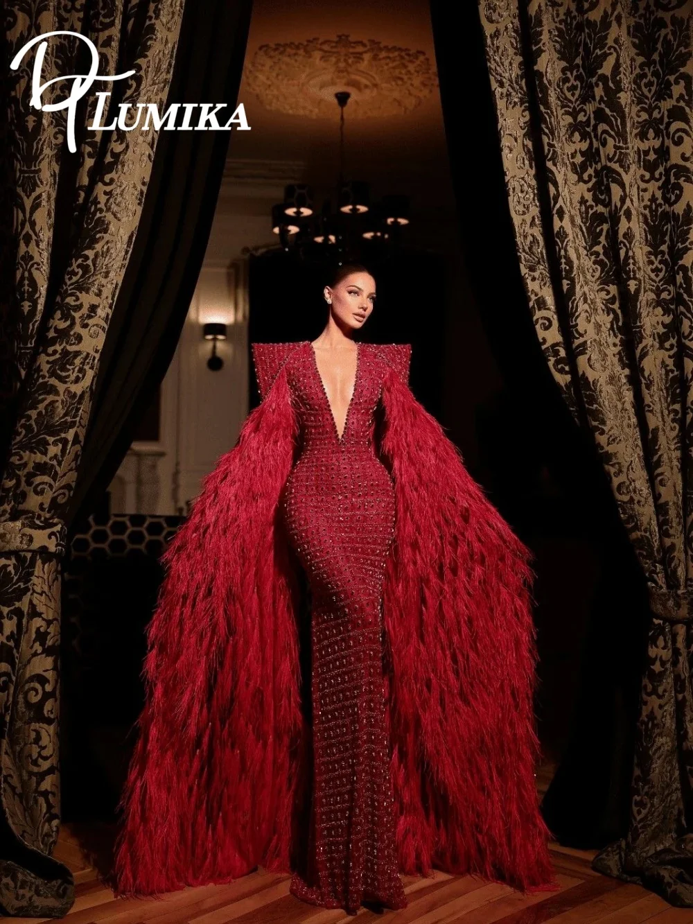 

Sophisticated Red Beaded Mermaid Gown 2026 Graceful Deep V-Neck Feather Cape Oversized Shoulder Evening Dress فساتين سهرة