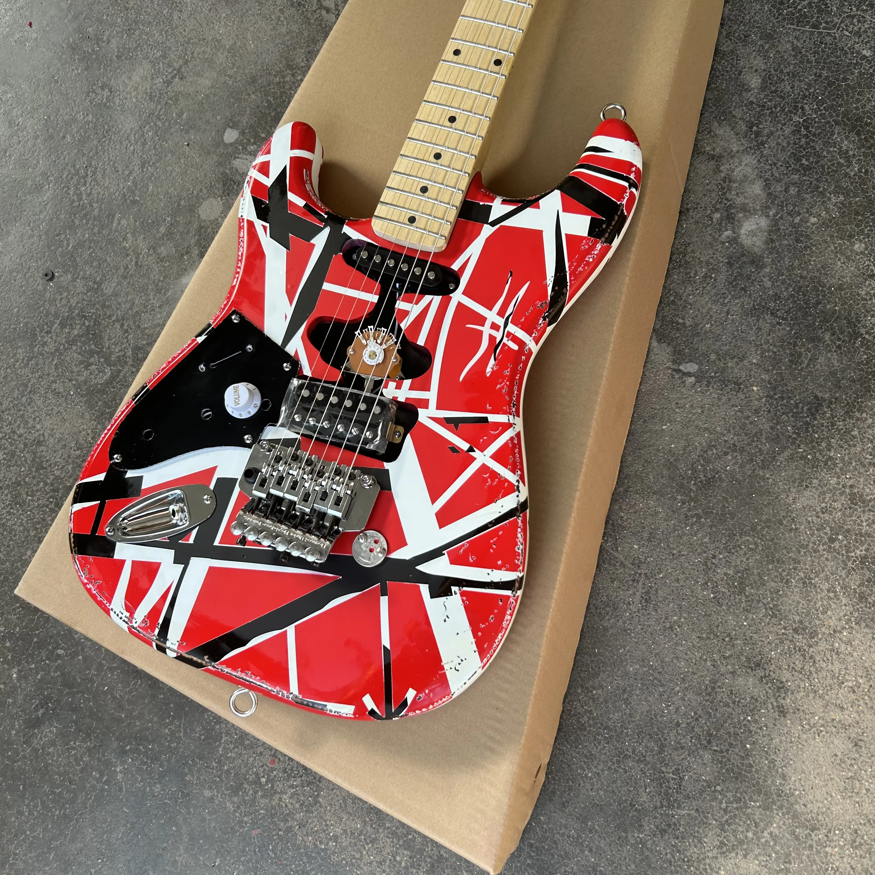 Left hand Edward Eddie Van Halen heavy cultural object red Franken electric guitar black and white stripes Freud rose Tremolo