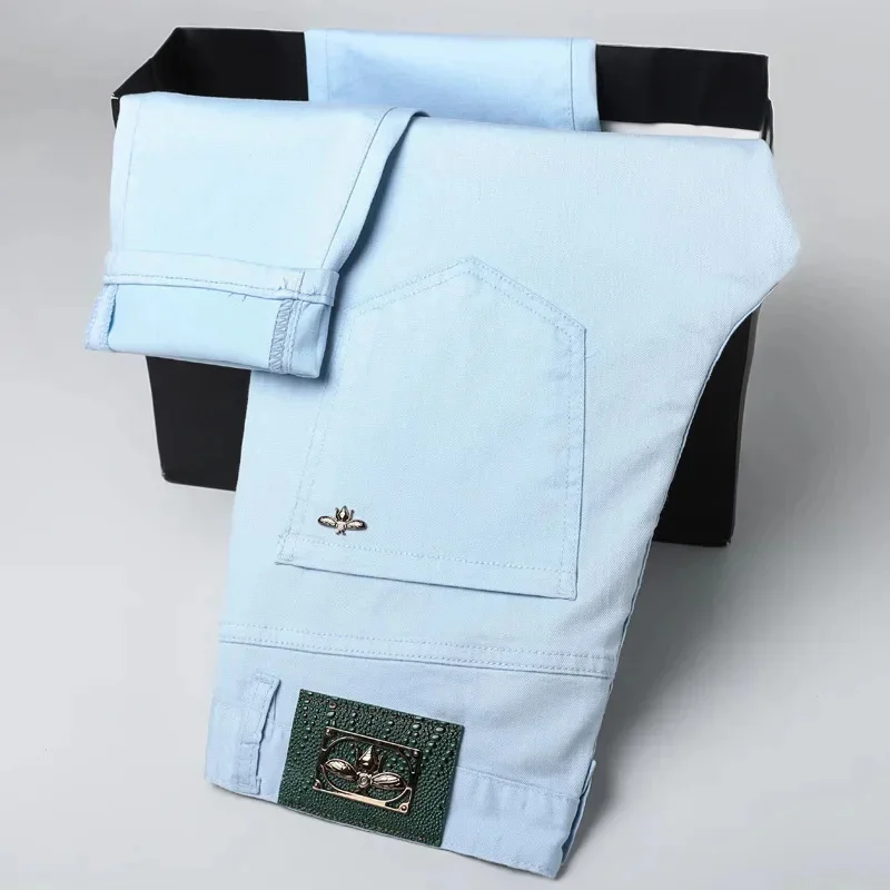 

Sky blue jeans men's slim fit small feet 2026 new spring and summer style light luxury clothing denim pants