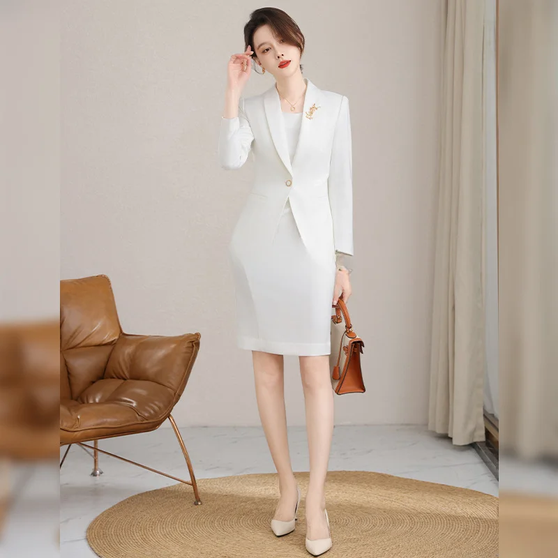 White sleeveless dress paired with a two-piece suit jacket