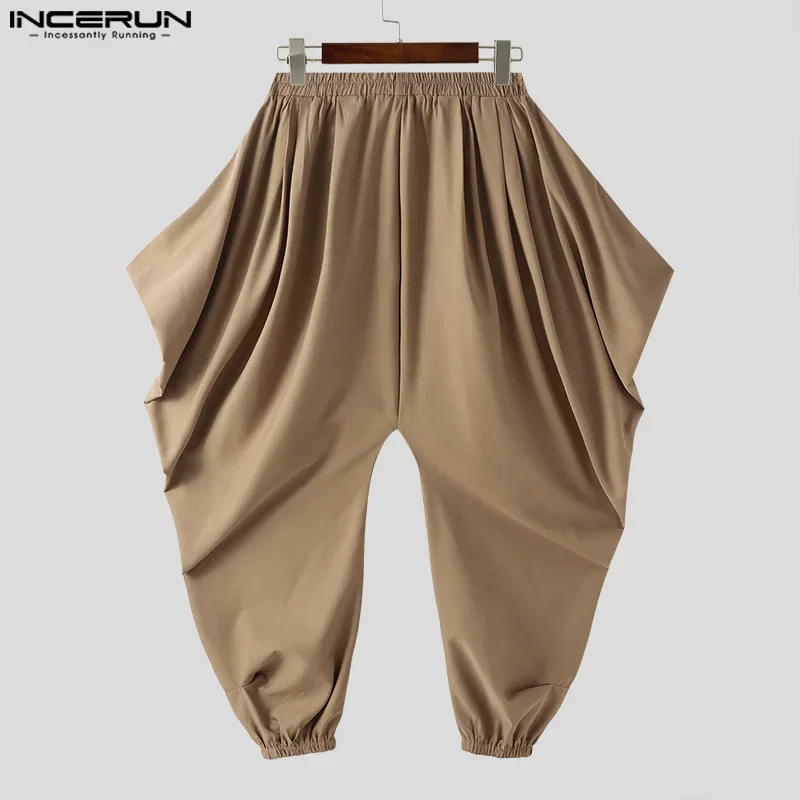 INCERUN Men Irregular Pants Solid Color Elastic Waist Joggers Loose Trousers Men Streetwear 2026 Drop-crotch Casual Harem Pants