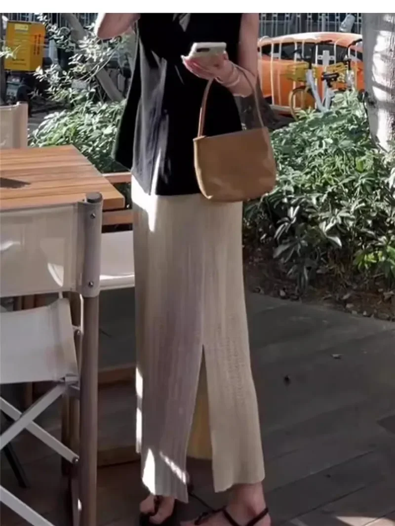 Gonna a trapezio scavata lavorata a maglia albicocca Donna 2025 Nuova primavera autunno Elastico in vita Spacco morbido Gonne temperamento versatile