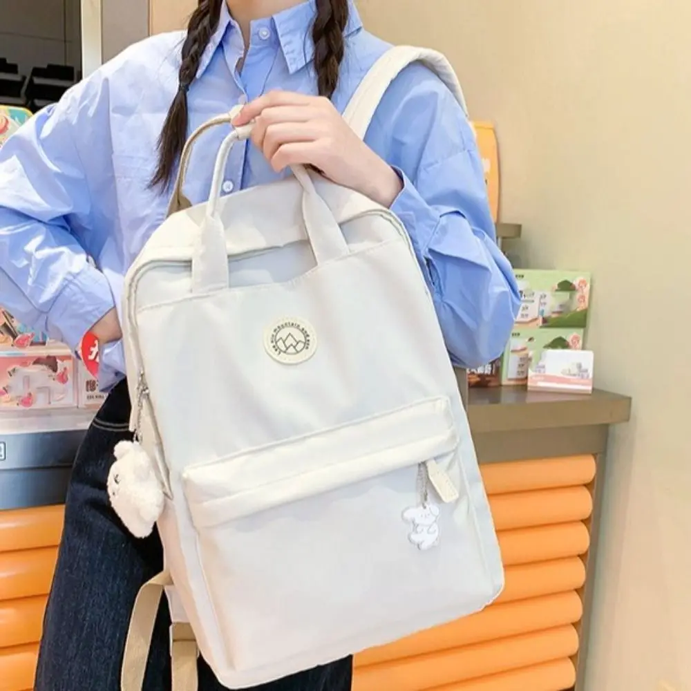 حقيبة ظهر نسائية خفيفة الوزن مقاومة للماء من النايلون بلون سادة حقيبة مدرسية ذات سعة كبيرة حقيبة ظهر مريحة للسفر لطلاب الجامعات