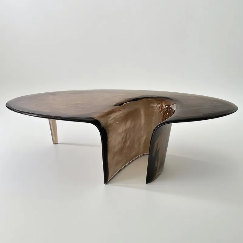 

Nordic high-end designer art imported resin special-shaped waterfall coffee table simple modern oval edge table
