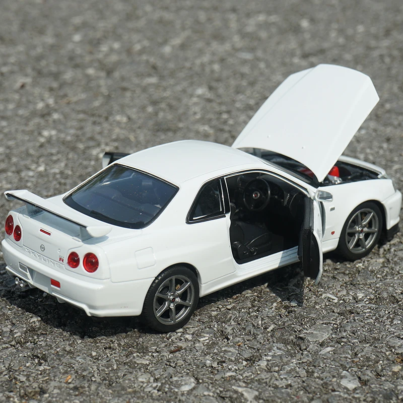 Welly-coche deportivo de aleación modelo Nissan Skyline GTR R34, juguete de Metal fundido a presión, colección de modelos de coches de carreras,