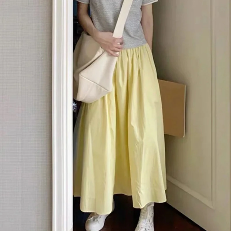 2025 Estate Bianco A Line Gonna Donna Moda coreana Elastico in vita Gonna lunga a pieghe Donna Tasca tinta unita Gonne medie Feamle