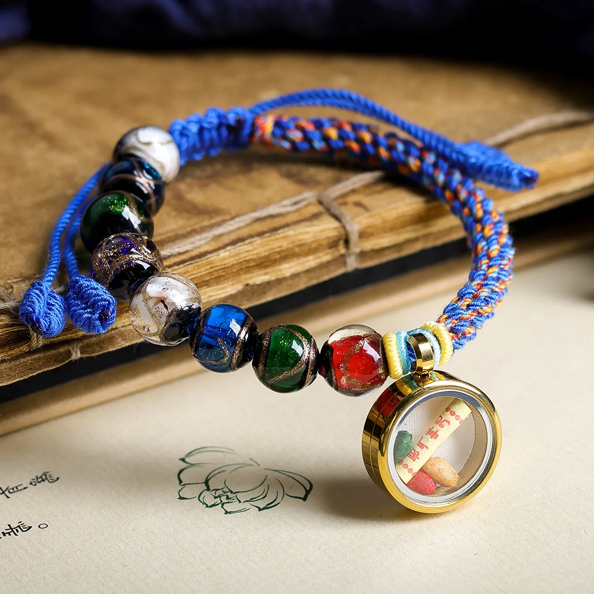 

Fragrant gray glass paired with yellow god of wealth thangka bracelet, cultural and woven hand rope jewelry