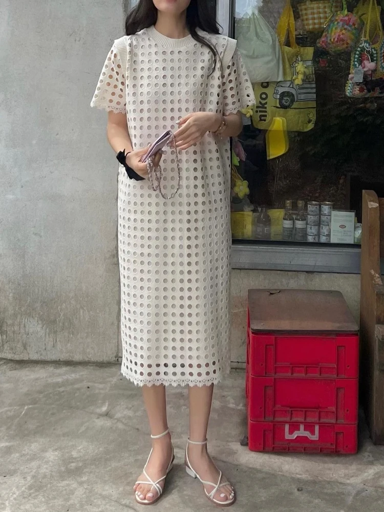 Elegantes Sommerkleid mit Rundhalsausschnitt und ausgehöhltem Design, Nische, lockeres, durchsichtiges, kurzärmliges Kleid für Damen, französische Urlaubs-Robe