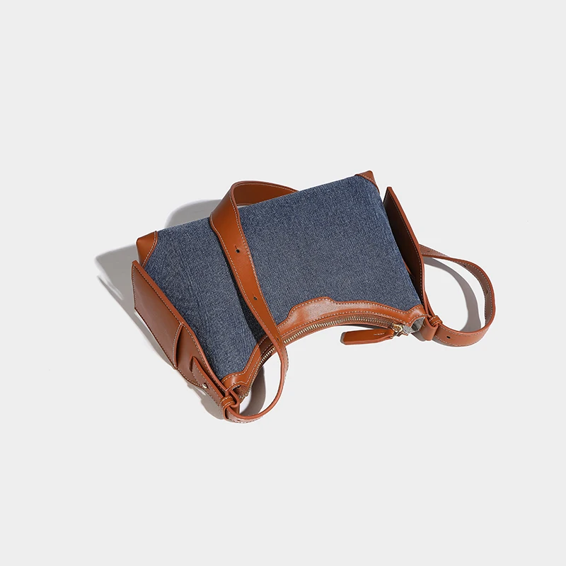 Nuevo diseñador de nicho Bolso de mezclilla retro de lujo Bolso de chica caliente de moda Bolso de axila exquisito y versátil Bolso de hombro simple e informal de gama alta Bolso cruzado moderno y de moda de gran