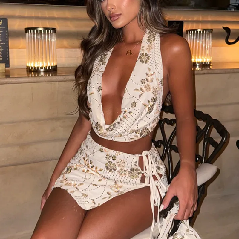 夏の女性のツーピーススカートセットスパンコールビーズフラワーホルターネック背中の開いたベストとタイアップミニスカート夏のパーティー衣装