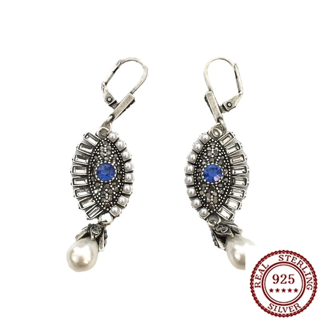 

2025 New Trend Classic Devil's Eye Diamond Studded Pearl Earrings with Feminine Temperament and Personality