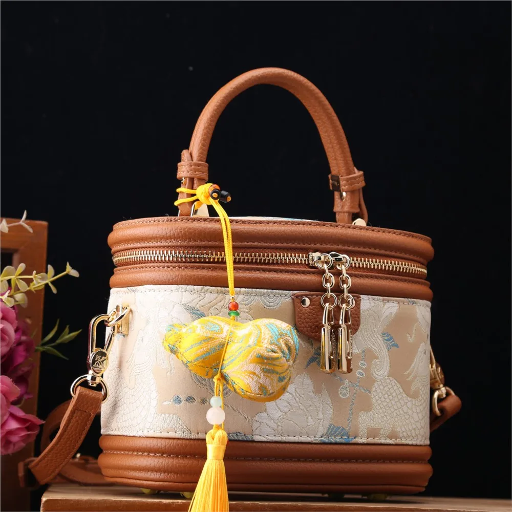 Authentic women's bag 2026 new Chinese woven gold and Song brocade bucket bag niche handbag red tassel crossbody bag trend