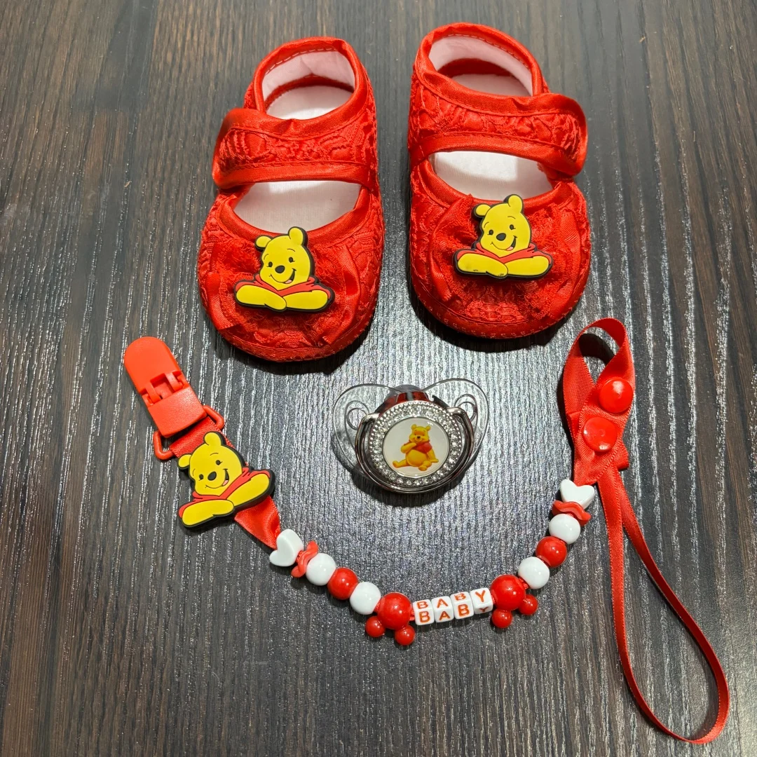 

Adorable baby pacifier paired with a clip and newborn shoes A safe chewing comfort toy for babies perfect gift for a baby party