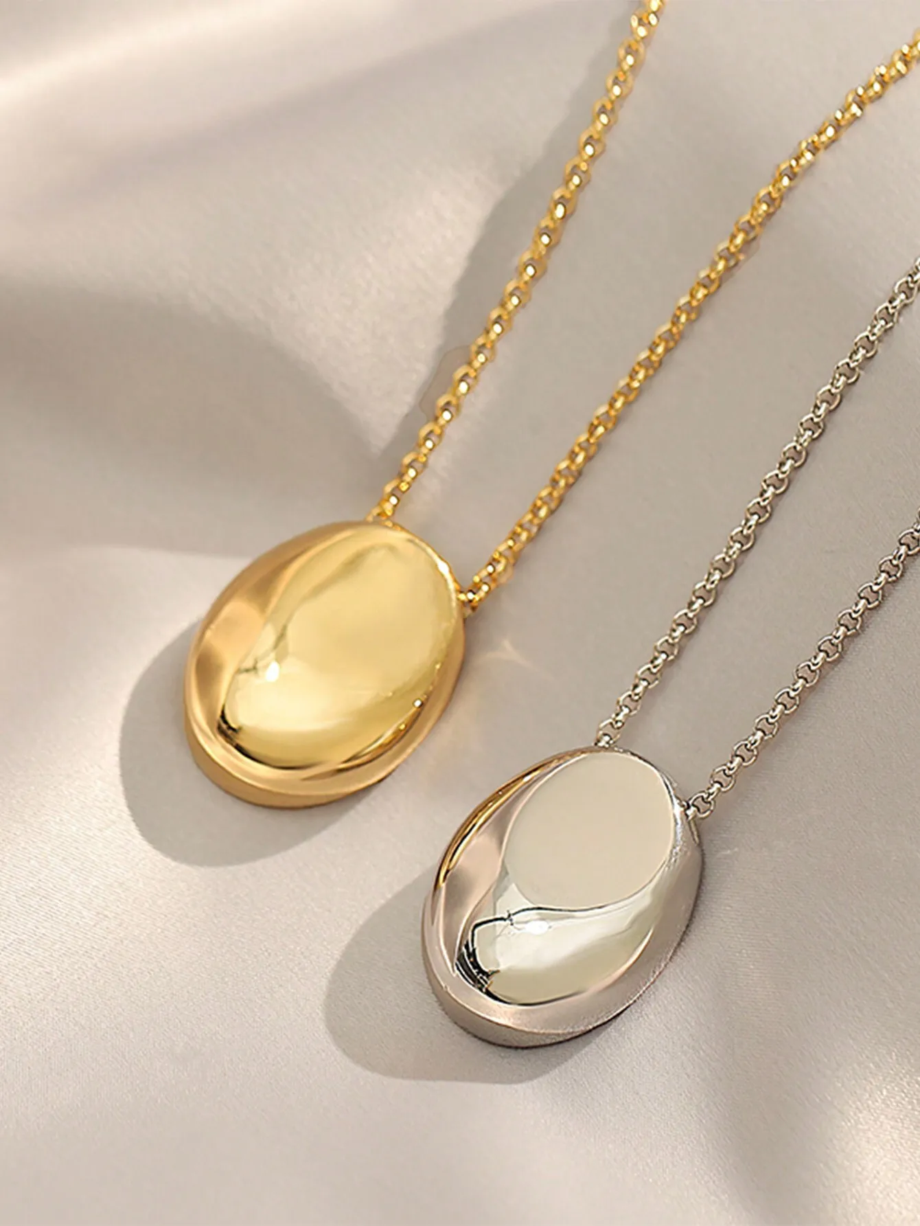 

Minimalist Oval Pendant Necklace in Gold and Silver Tone Stainless Steel Chain