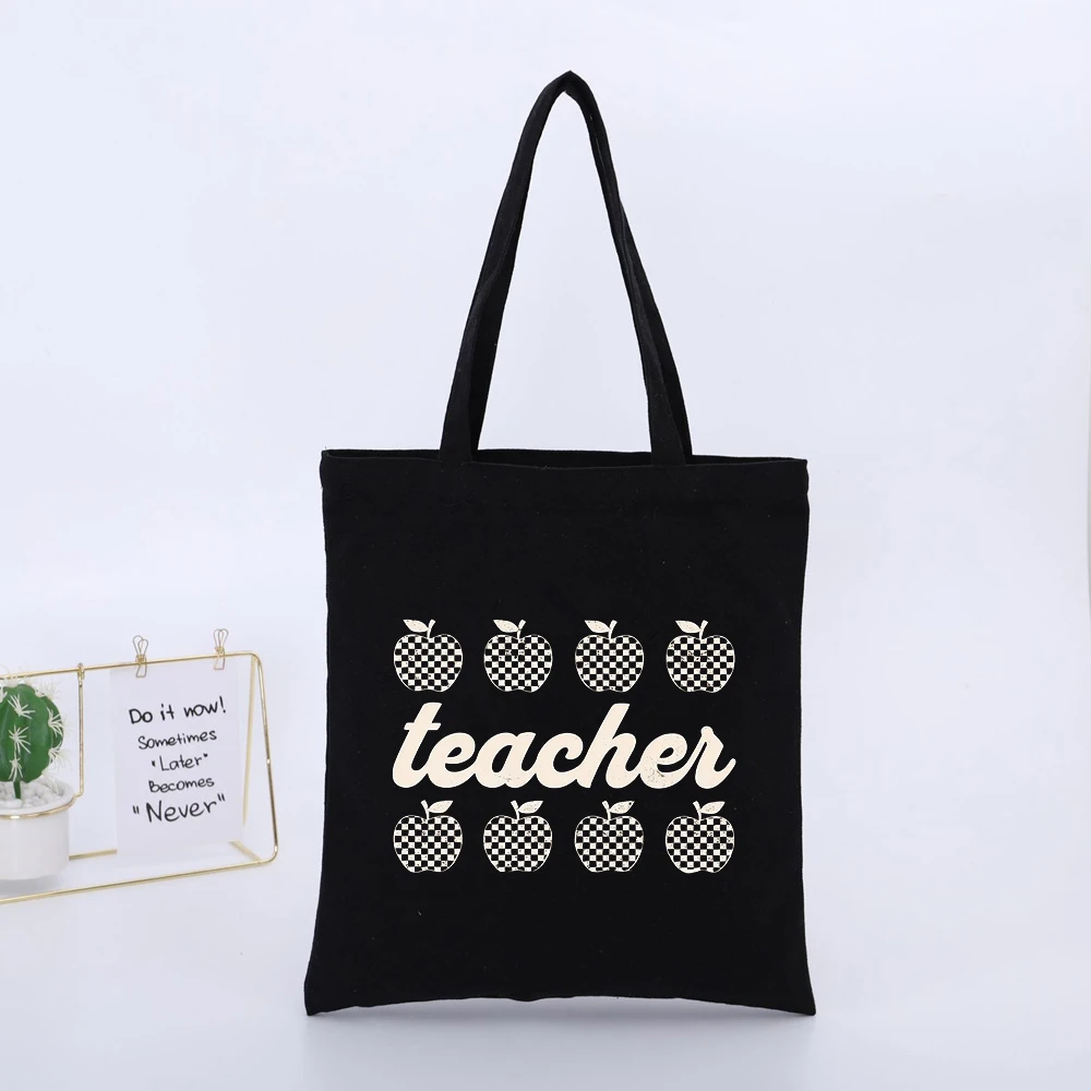 Teacher's Black Canvas Tote Bag with Checkered Apple and Typography Print, Ideal for Daily School Use and Casual Outings