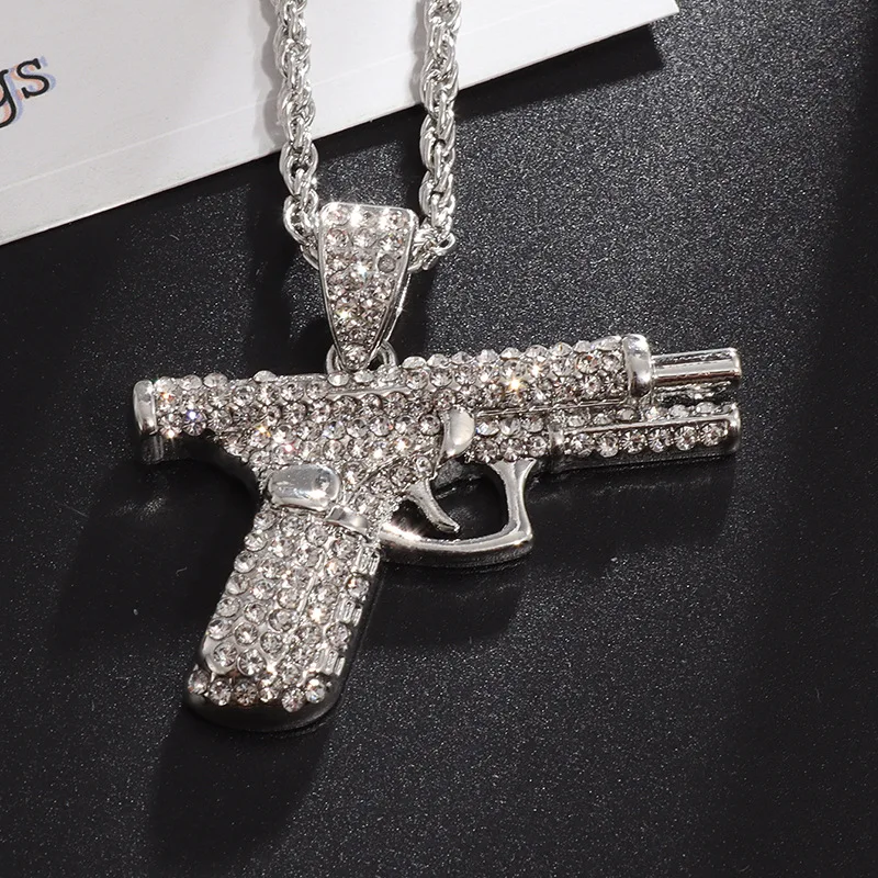 Hip-hop style small pistol necklace with embedded diamonds for men. A must-have accessory for men's hip-hop style street parties