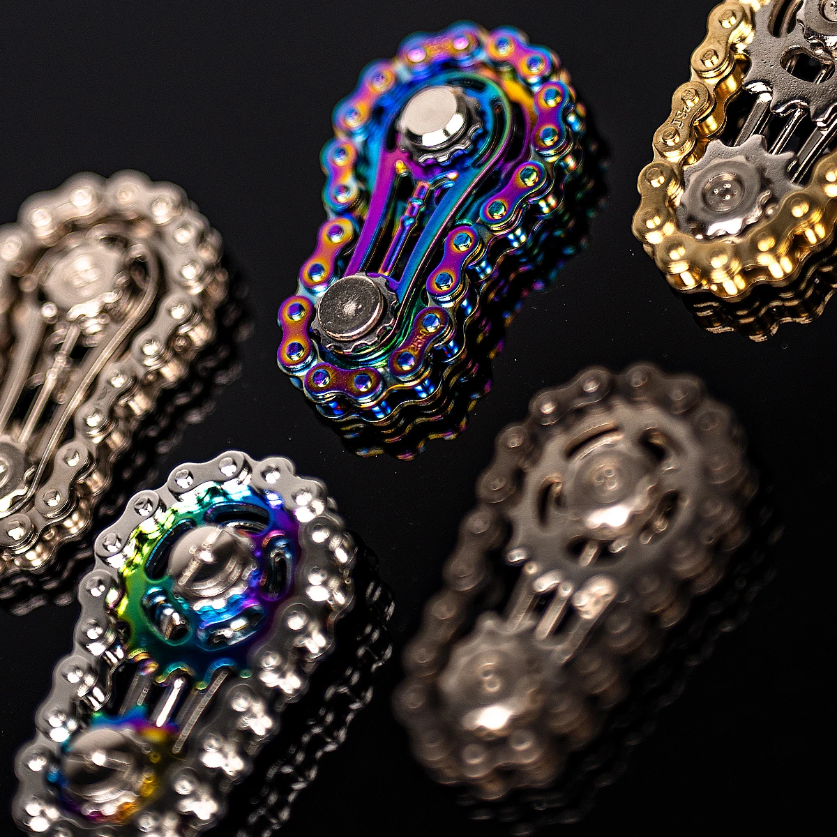 1 لعبة دوارة متململة على شكل سلسلة دراجات معدنية ملونة، فعالة في تخفيف التوتر