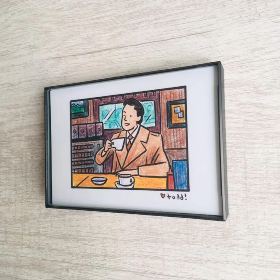 “Vintage-Style Hand-Drawn Illustration Art Print - Charming Man Enjoying Coffee in a Cozy Café Scene | Whimsical Retro Wall Deco view 3