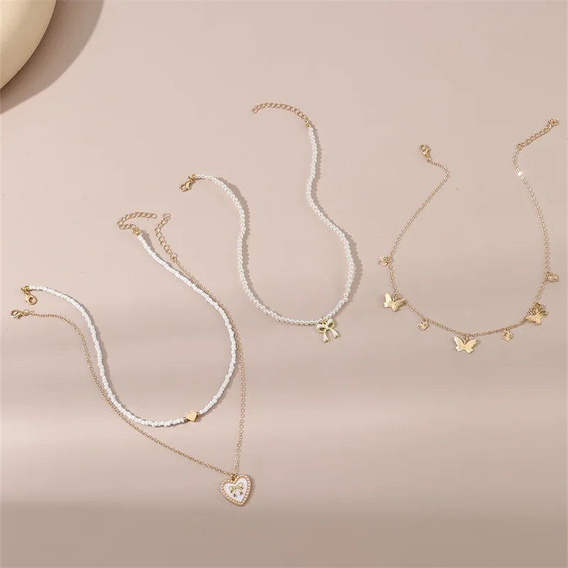 4pcs/set Kids Everyday White Bead Set – Butterfly & Heart Pendants on Stackable Strands for Effortless, Adorable Style.