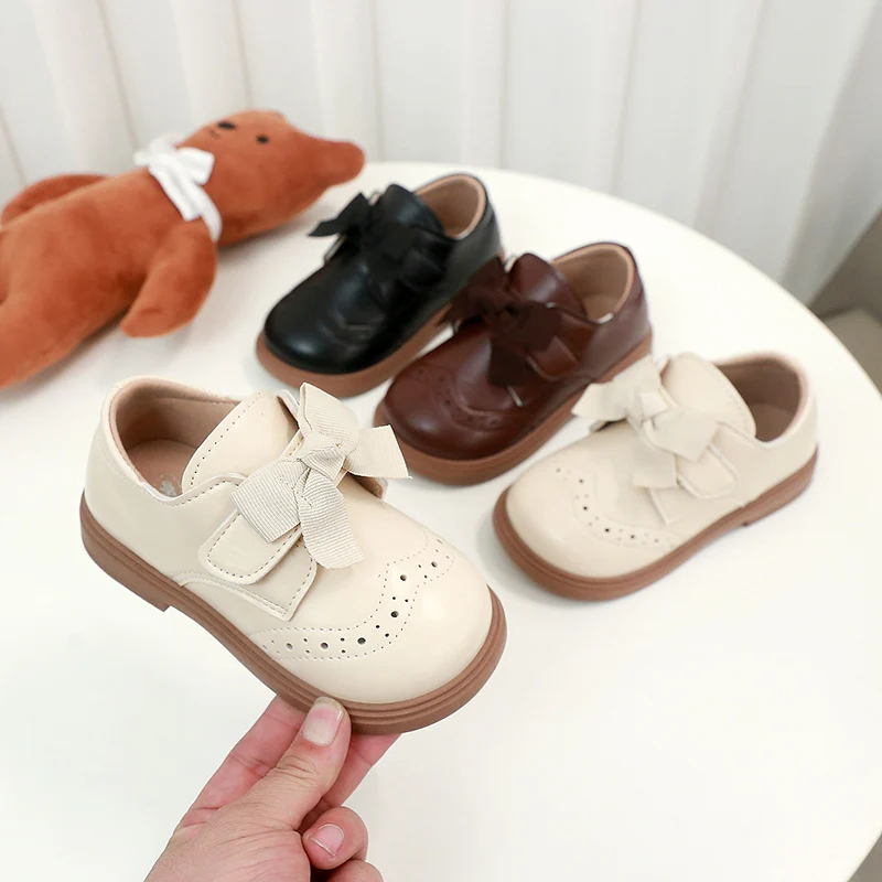 สาวรองเท้าหนังหวาน Bows เด็กเจ้าหญิงรองเท้า Retro สไตล์อังกฤษ 2025 เด็กใหม่แบนรองเท้า Soild สีลื่น
