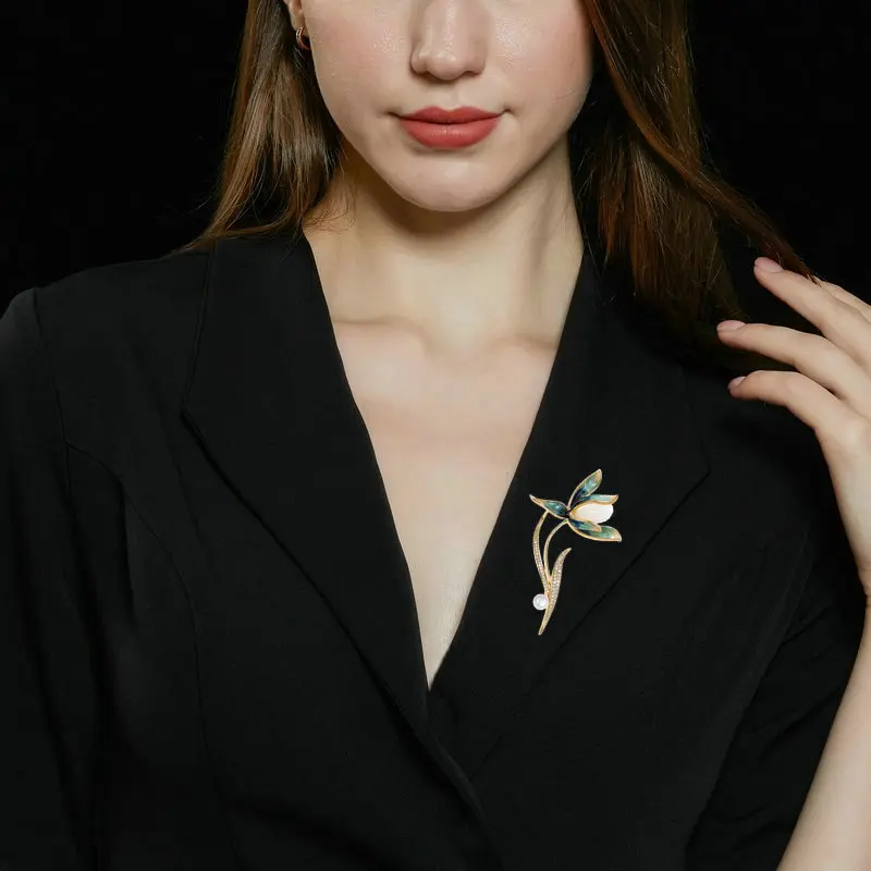 

Elegant and stylish new clothing, evening gowns, autumn and winter coats, corsages, accessories and brooches