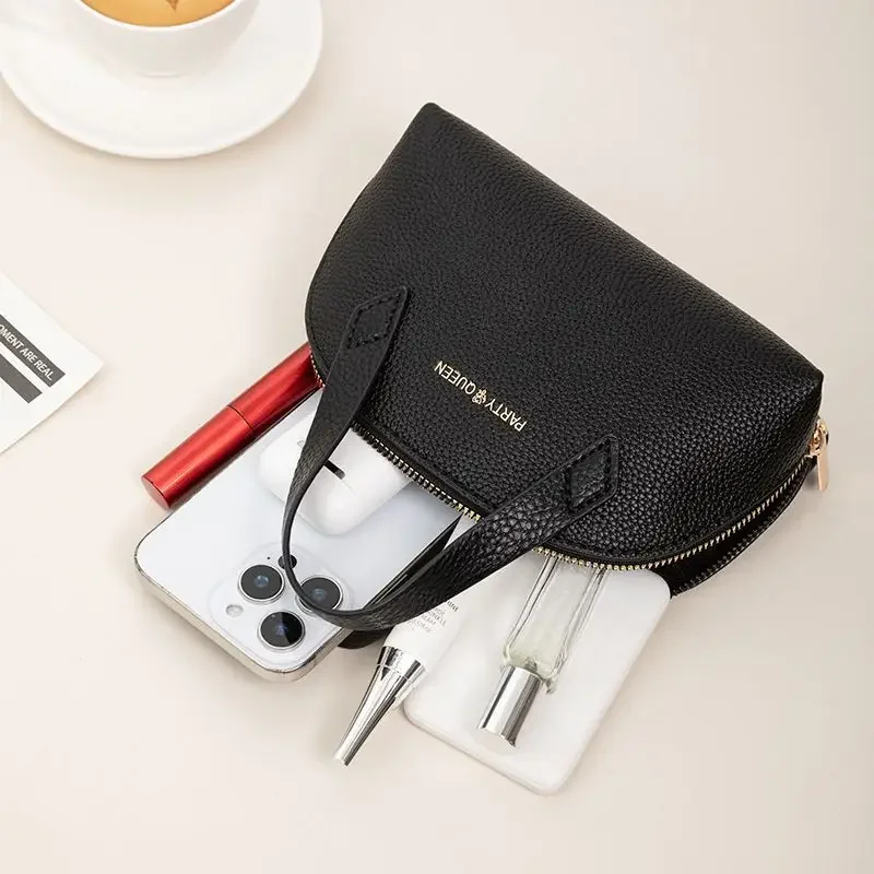 2025, neue schalenförmige tragbare Make-up-Tasche, schöne Handtasche aus schwarzem PU-Leder. Das Leder ist weich, klein und zart.