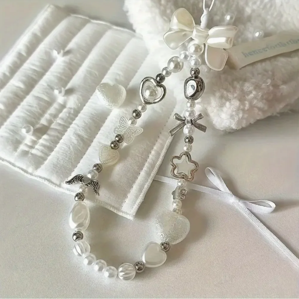 

Удобный ремешок на запястье с жемчугом в стиле барокко, стильный ремешок для телефона, подвеска для камеры, незаменимый аксессуар для ежедневного использования.