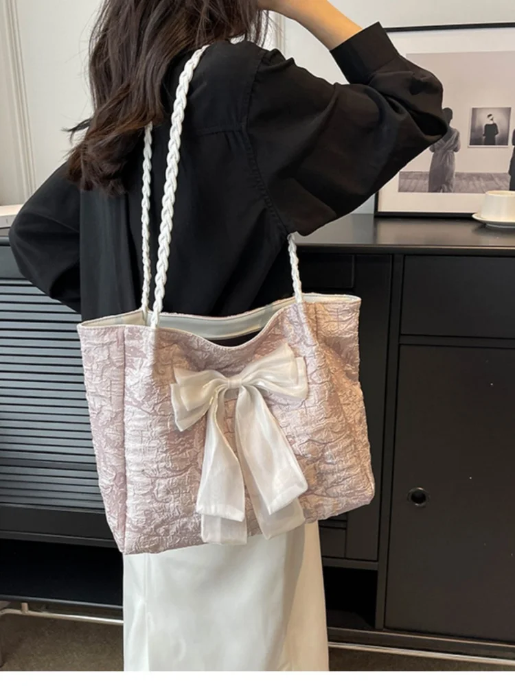 Легкая роскошная универсальная холщовая сумка большой вместимости на одно плечо, новинка 2025, модная сумка-тоут с бантом подмышками, женская пригородная сумка на плечо