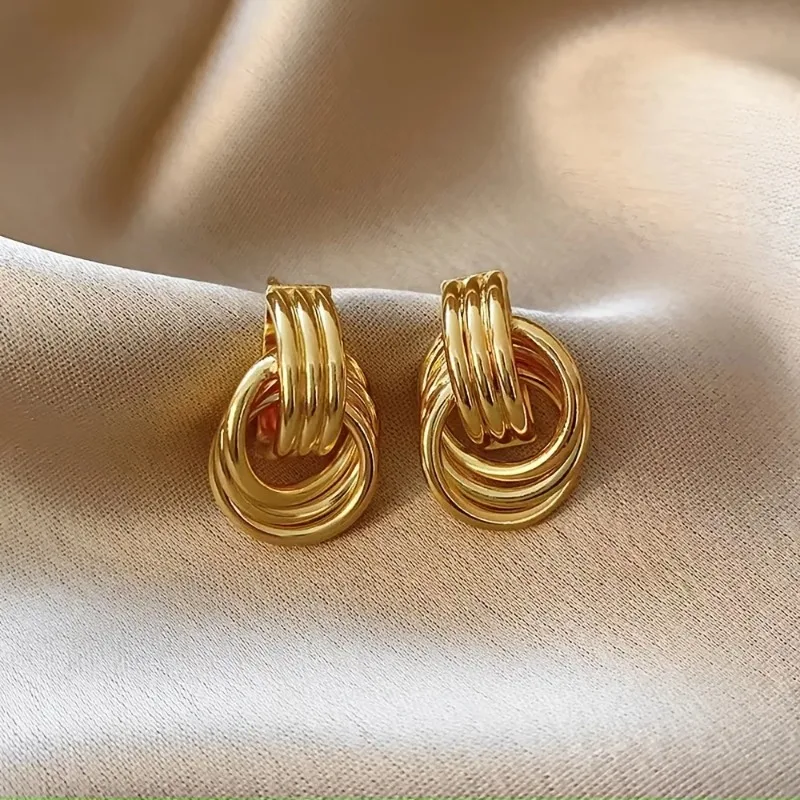 Stylish Gold-Tone Alloy Earrings Featuring a Multi-Turn Knotted Design, Perfect for Women.These Hoop Studs Make a Statement - Detail 1