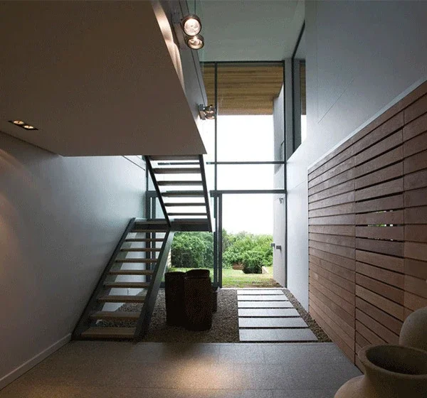 Stairs with stainless steel handrails and plastic steps