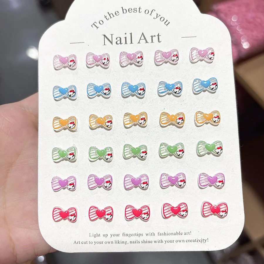 100 Stück/Packung 6,5 x 11 mm Hello Kitty Bow Nagel-Charms – kristallklare Harz-Herz-Nagelkunst, süße 3D-Nageldekoration für Kawaii-Maniküre