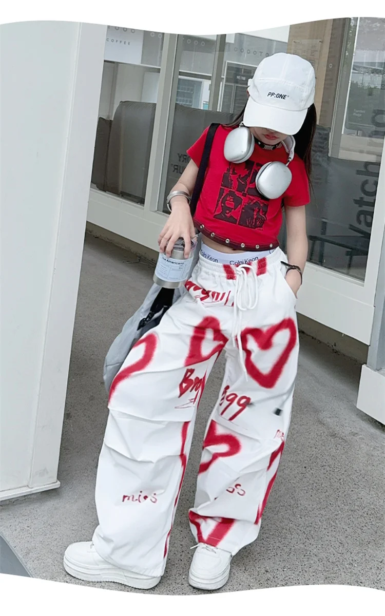 Kinder Hip-Hop Modehose mit Kordelzug und Zeichnungen für Teenager-Mädchen Coole Y2K Streetwear-Hose mit Herz-Graffiti 5-14 Jahre – Detail 9