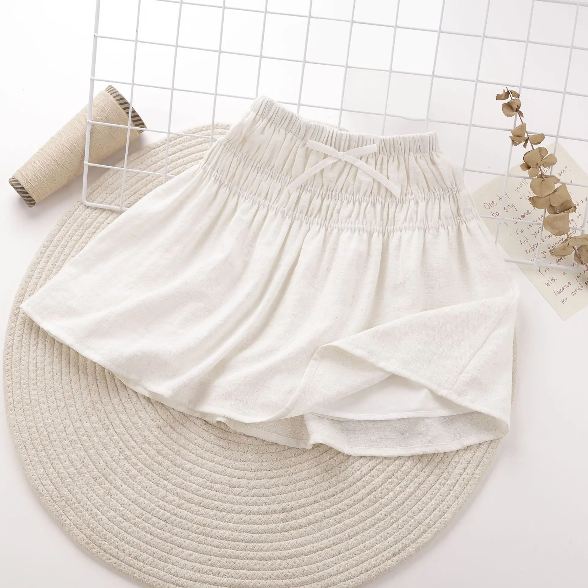 تنورة كورية متعددة الاستخدامات قابلة للتنفس وخفيفة الوزن للأطفال البنات تنورة ميدي من نسيج القطن والكتان مع فيونكة جديدة ولطيفة