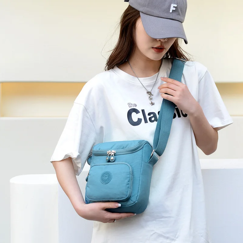 

2025 Vertical Shoulder Bag Lightweight Canvas Purse for Women Mini Crossbody Tote Compact Day-to-Night Bag Casual Sling Bag​
