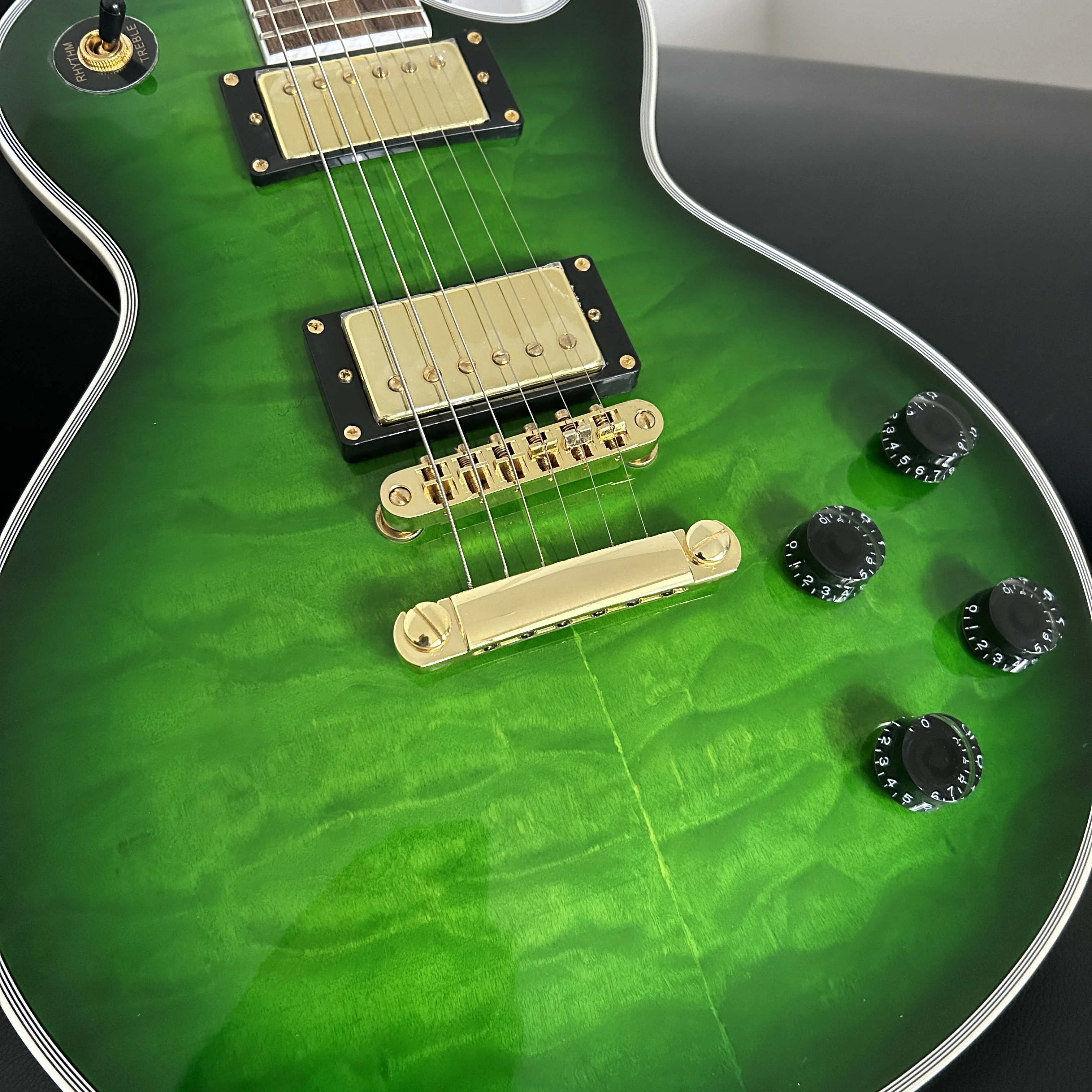 

Custom green Electric Guitar, Solid Wood, emerald green gradient color,Golden Metal Parts, Top Quality, In Stock,made in china