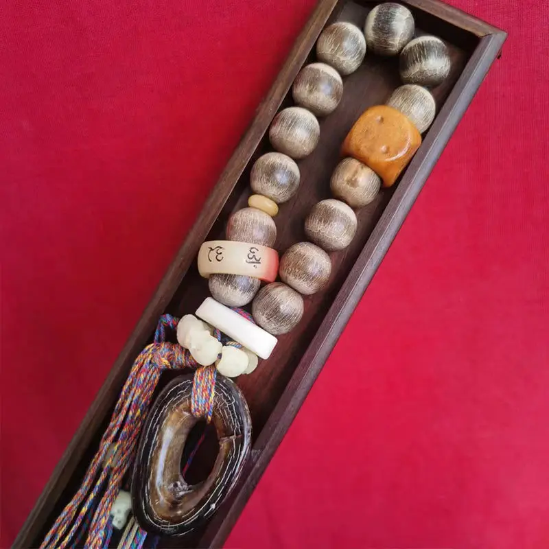 Tibetan-style old ox horn 18mm round beads paired with two dice a six-sided and a skull-shaped ring