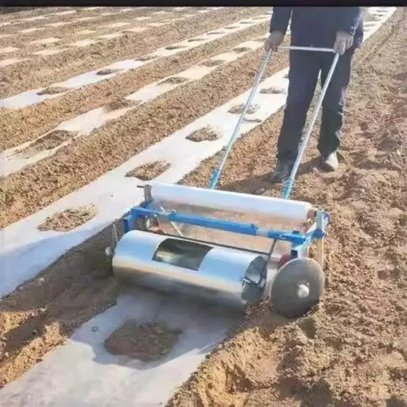 Manual miniature agricultural mulching machine, plastic film laying machine, roller-type mulching machine.