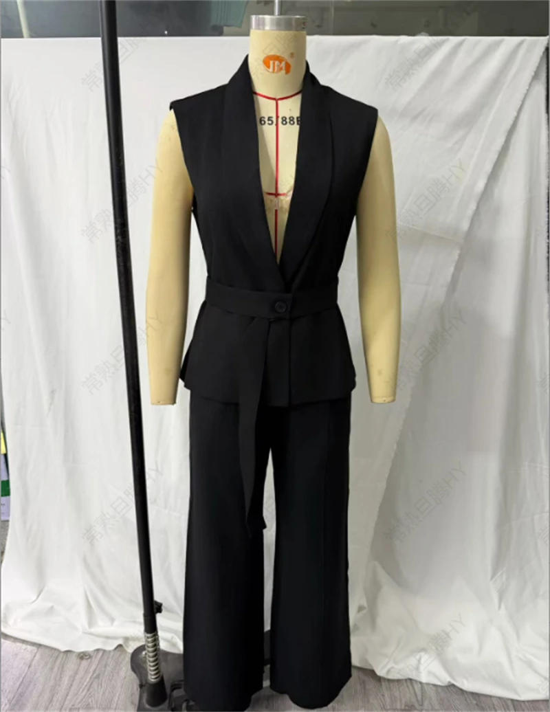 KEYANKETIAN 2026 Minimalist Black Suit Set Sleeveless Lapel Tie Waistcoat High Waist Pleated Wide Leg Long Trousers